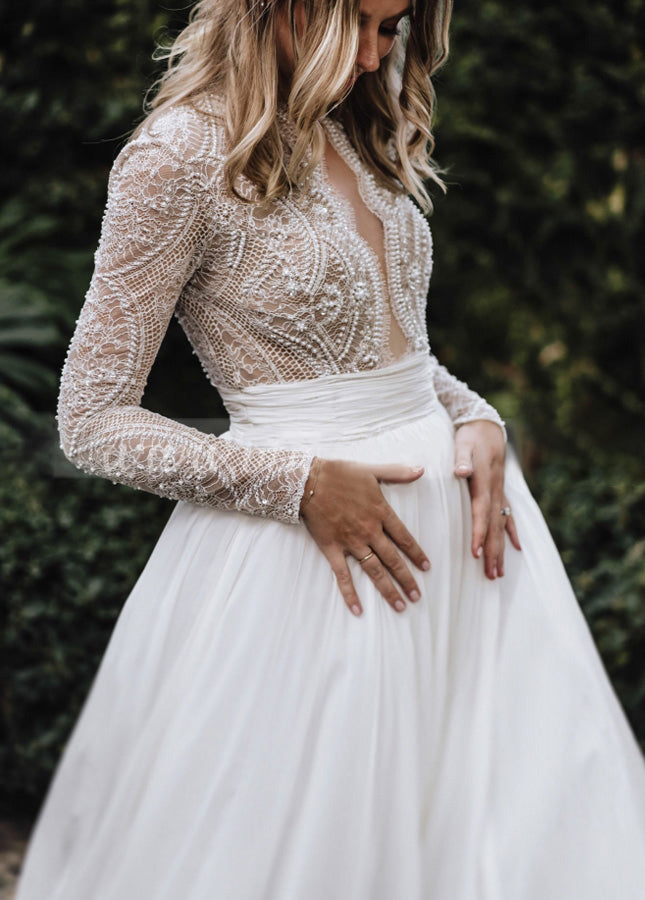 Luxurious A-Line Tulle Wedding Dress with Pleats, Lace Beading, and Long Sleeves