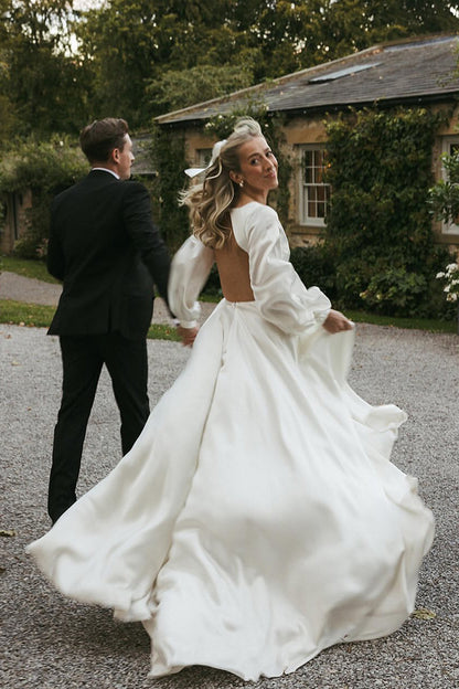 Gorgeous A-Line Deep V-Neck White Satin Bridal Dress with Ruffled Sleeves