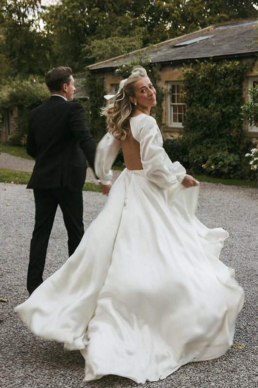 Gorgeous A-Line Deep V-Neck White Satin Bridal Dress with Ruffled Sleeves